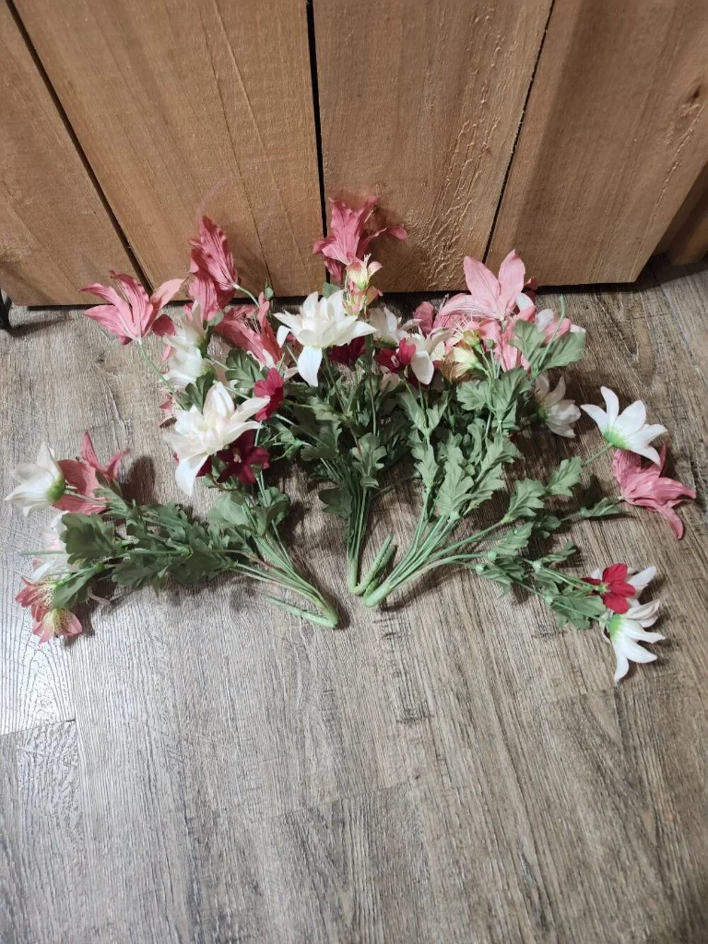 vintage floral arrangement of artificial flowers in small vase